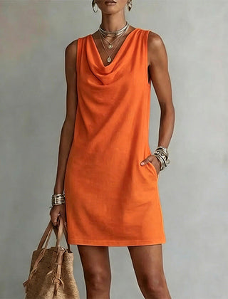 Women's orange sleeveless pocket mini dress with a draped neckline.
