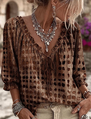 Women's relaxed brown polka dot blouse with a lace-up V-neck and three-quarter puff sleeves