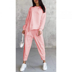 Women's relaxed irregular hem sweatshirt and pants set in pink