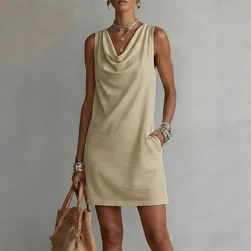 Women's khaki sleeveless pocket mini dress with a draped neckline.