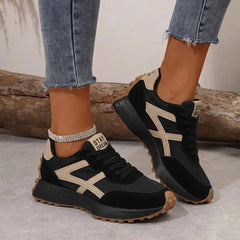 Women's orthopaedic comfort trainers with layered side panels and a textured gum outsole