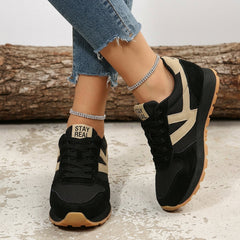 Women's black and beige orthopaedic comfort trainers with a cushioned gum sole