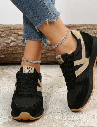 Women's black and beige orthopaedic comfort trainers with a cushioned gum sole