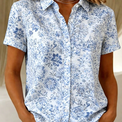 Women's relaxed sea blue floral short-sleeve button-up shirt.