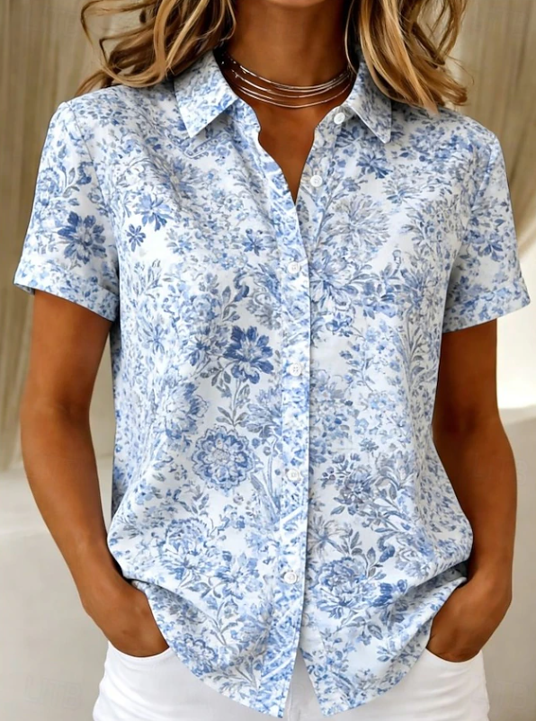 Women's relaxed sea blue floral short-sleeve button-up shirt.