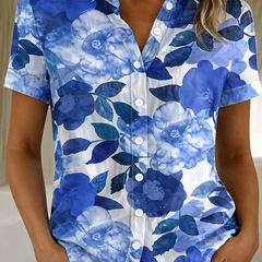 Women's relaxed blue floral short-sleeve button-up shirt.