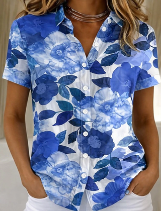 Women's relaxed blue floral short-sleeve button-up shirt.
