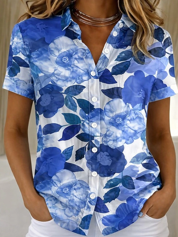 Women's relaxed blue floral short-sleeve button-up shirt.
