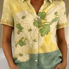 Women's relaxed yellow floral short-sleeve button-up shirt.