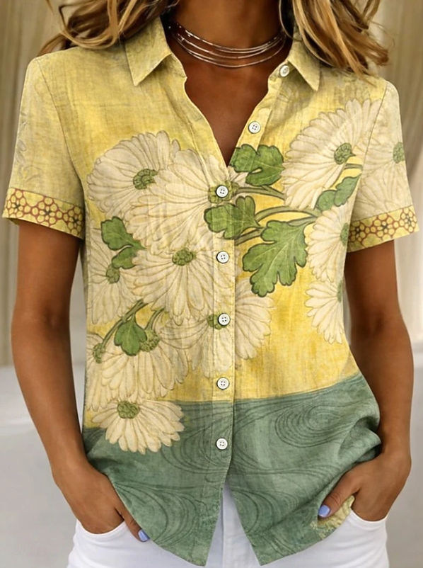 Women's relaxed yellow floral short-sleeve button-up shirt.