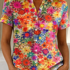 Women's relaxed orange floral short-sleeve button-up shirt.