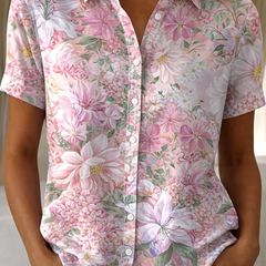 Women's relaxed pink floral short-sleeve button-up shirt.