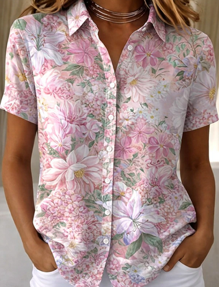 Women's relaxed pink floral short-sleeve button-up shirt.