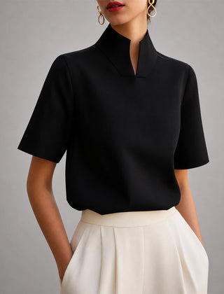 Women's black short-sleeve structured blouse with a V-cut mock neck.