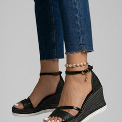 Women's black slip-on sandals with a cushioned footbed