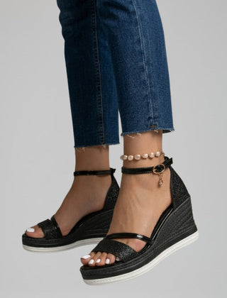 Women's black slip-on sandals with a cushioned footbed