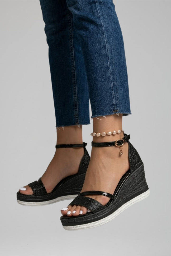 Women's black slip-on sandals with a cushioned footbed
