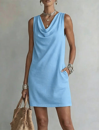 Women's sky blue sleeveless pocket mini dress with a draped neckline.