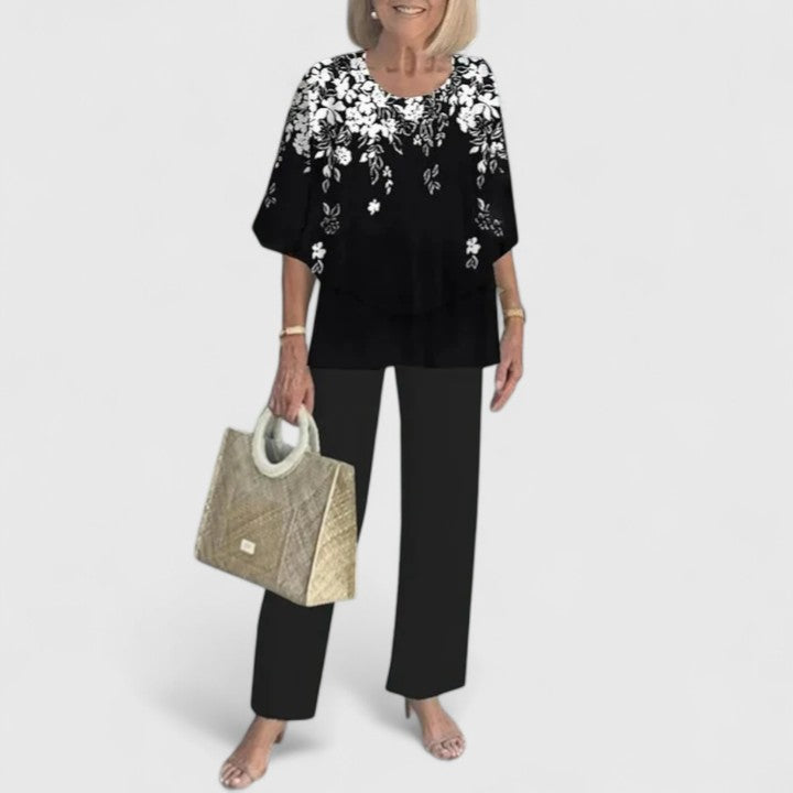 Women's two-piece set with black and white floral top and black pants