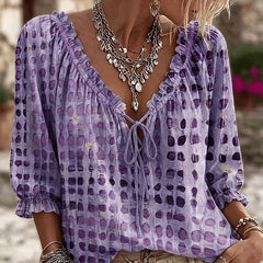 Women's relaxed purple polka dot blouse with a lace-up V-neck and three-quarter puff sleeves