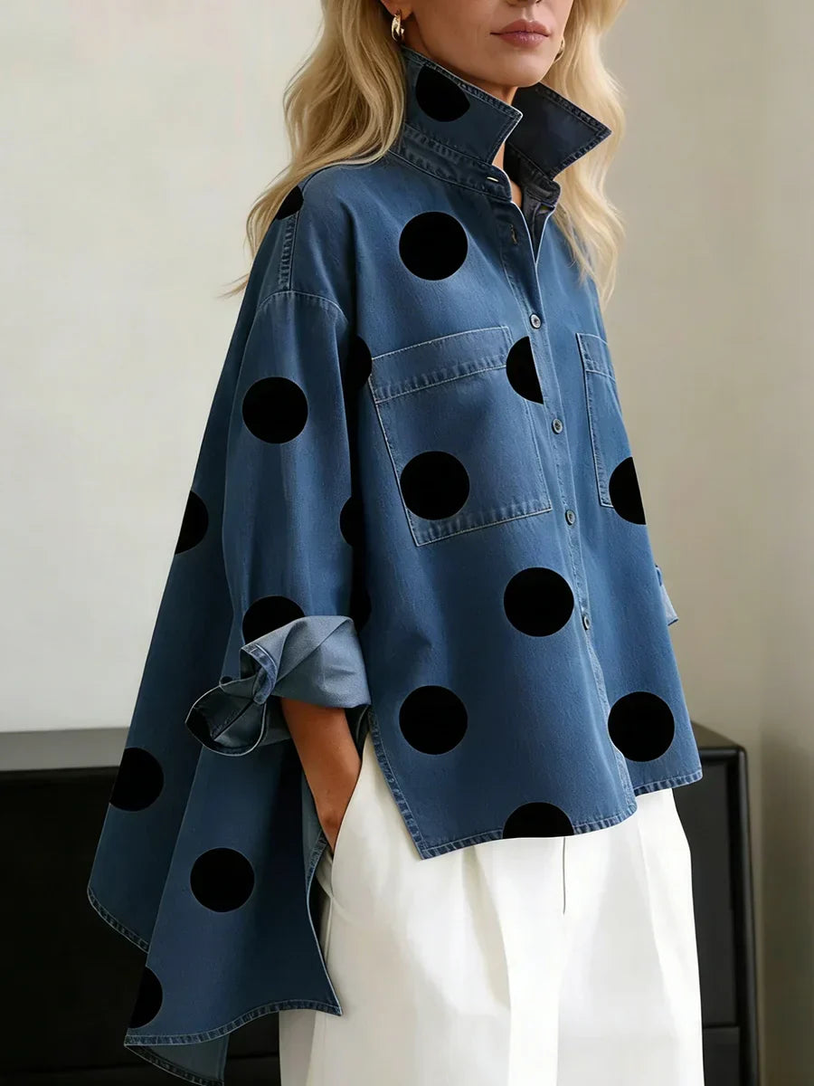 Women's blue polka dot button-up shirt with spread collar and chest pockets.