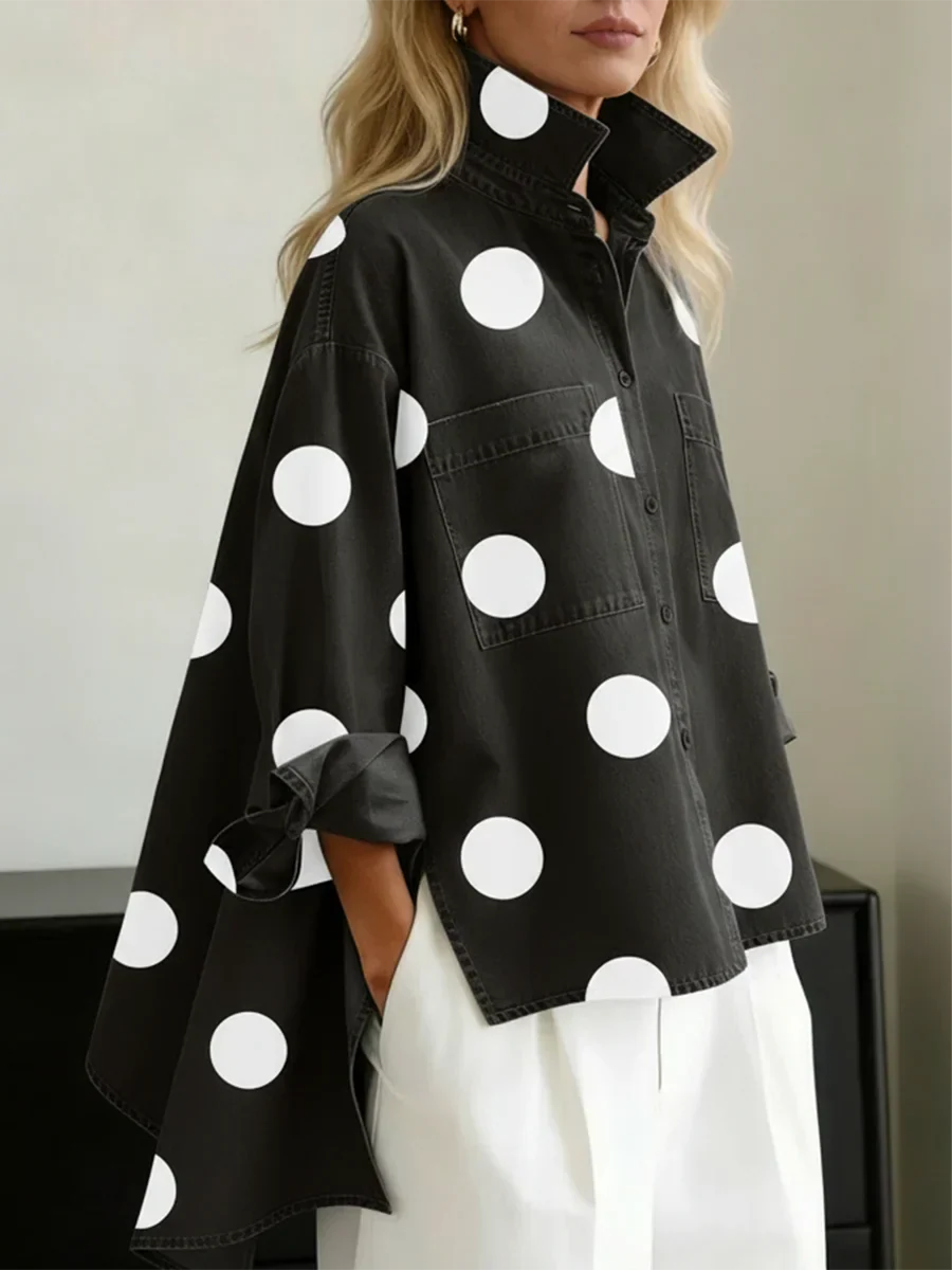 Women's black polka dot button-up shirt with spread collar and chest pockets.