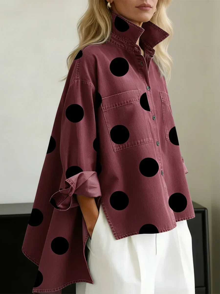 Women's red polka dot button-up shirt with spread collar and chest pockets.
