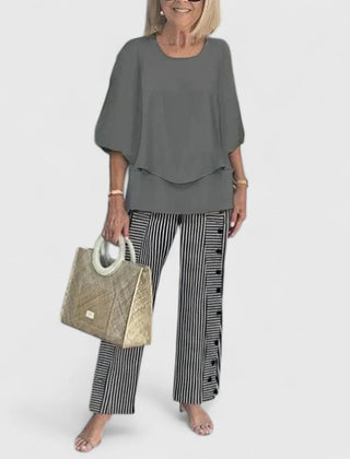 Women's loose two-piece set in charcoal grey with striped pants