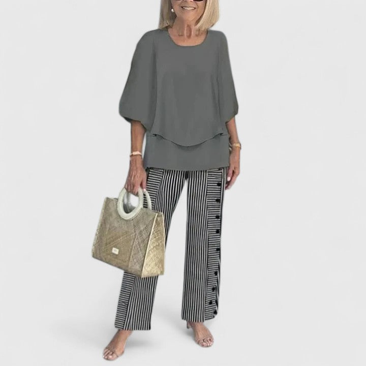 Women's loose two-piece set in charcoal grey with striped pants