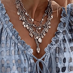 Woman wearing the Araminta relaxed blouse with gently puffed three-quarter sleeves