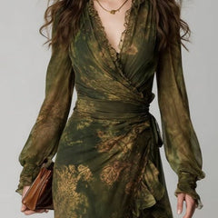 Long sleeve green floral wrap dress with V-neckline, shown in full length.