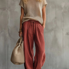 Women's red knit pullover top and linen-cotton trousers two-piece set, front view