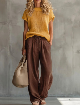Close-up of the red knitted pullover top texture and crew neckline