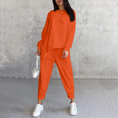Women's relaxed irregular hem sweatshirt and pants set in orange